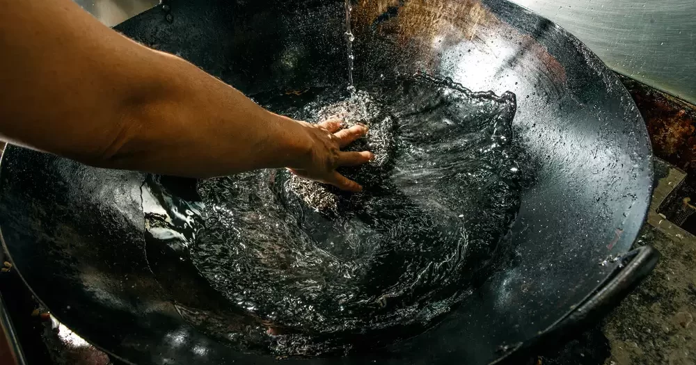 cleaning a kitchen wok