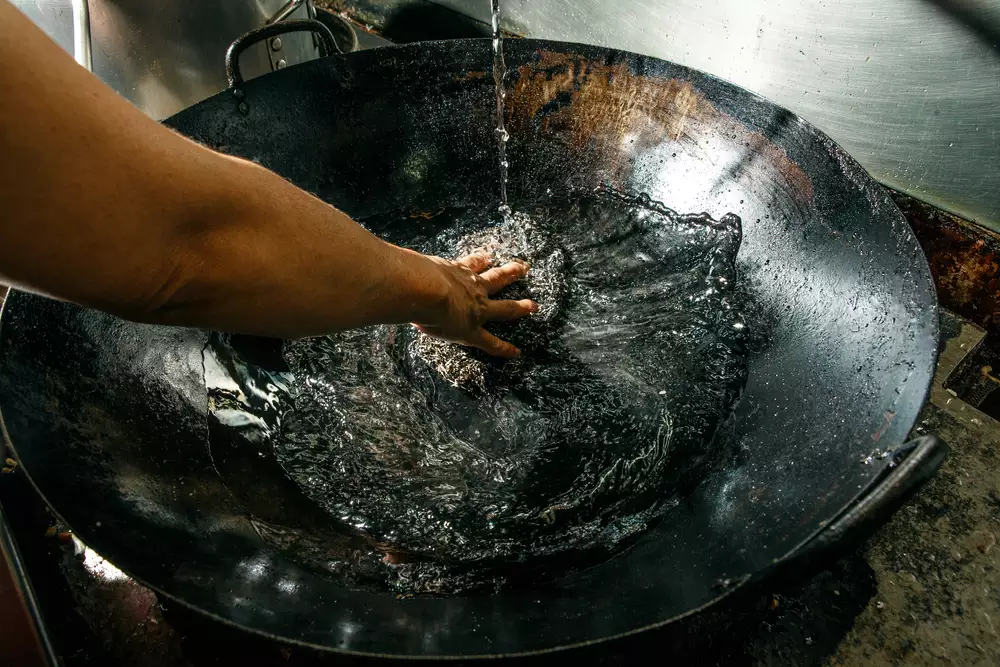 cleaning a kitchen wok