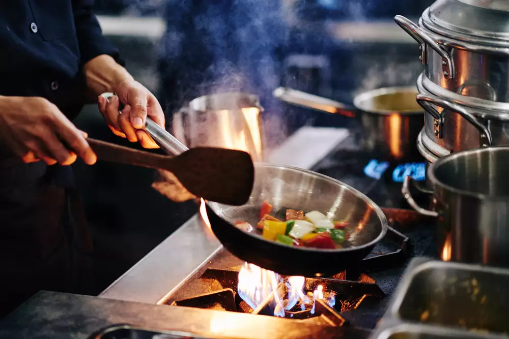 frying vegetables on pan