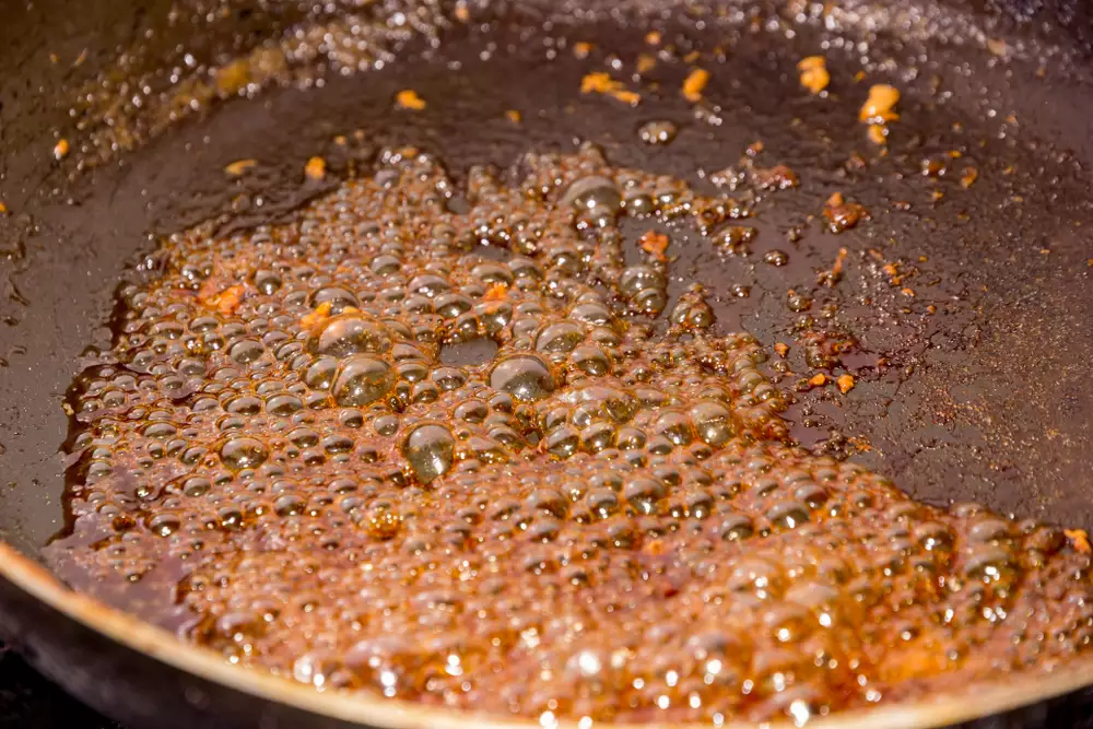 sugar caramelizing in a wok