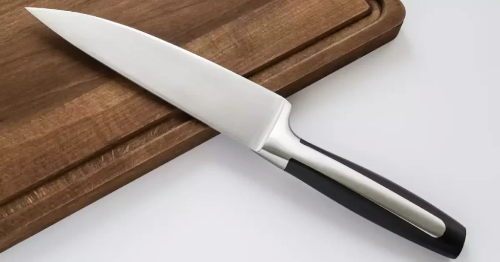 Stainless knife on cutting board